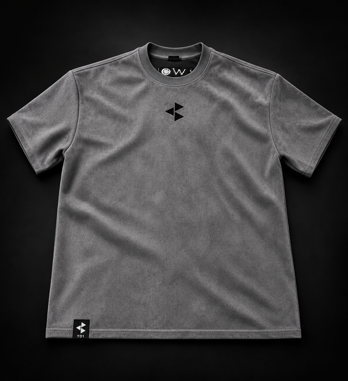 TD1WORLD Engineered Winter Tee in Charcoal Grey, front, black embroidered logo and TD1 hem label