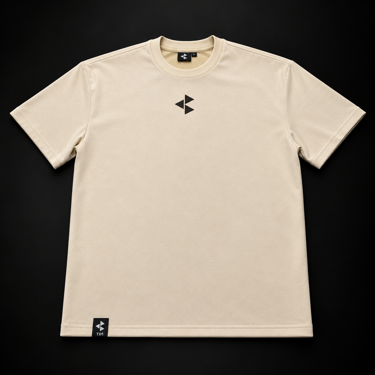 TD1WORLD Engineered Winter Tee in Luxury Beige, front, black embroidered logo and TD1 hem label